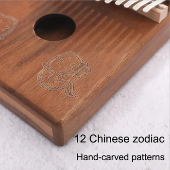 17-galvenais, kalimba īkšķi klavieres Ķīniešu zodiaka modelis portatīvo īkšķi klavieres nodrošina labu skaņas kvalitāti un mācību grāmatu iesācējiem
